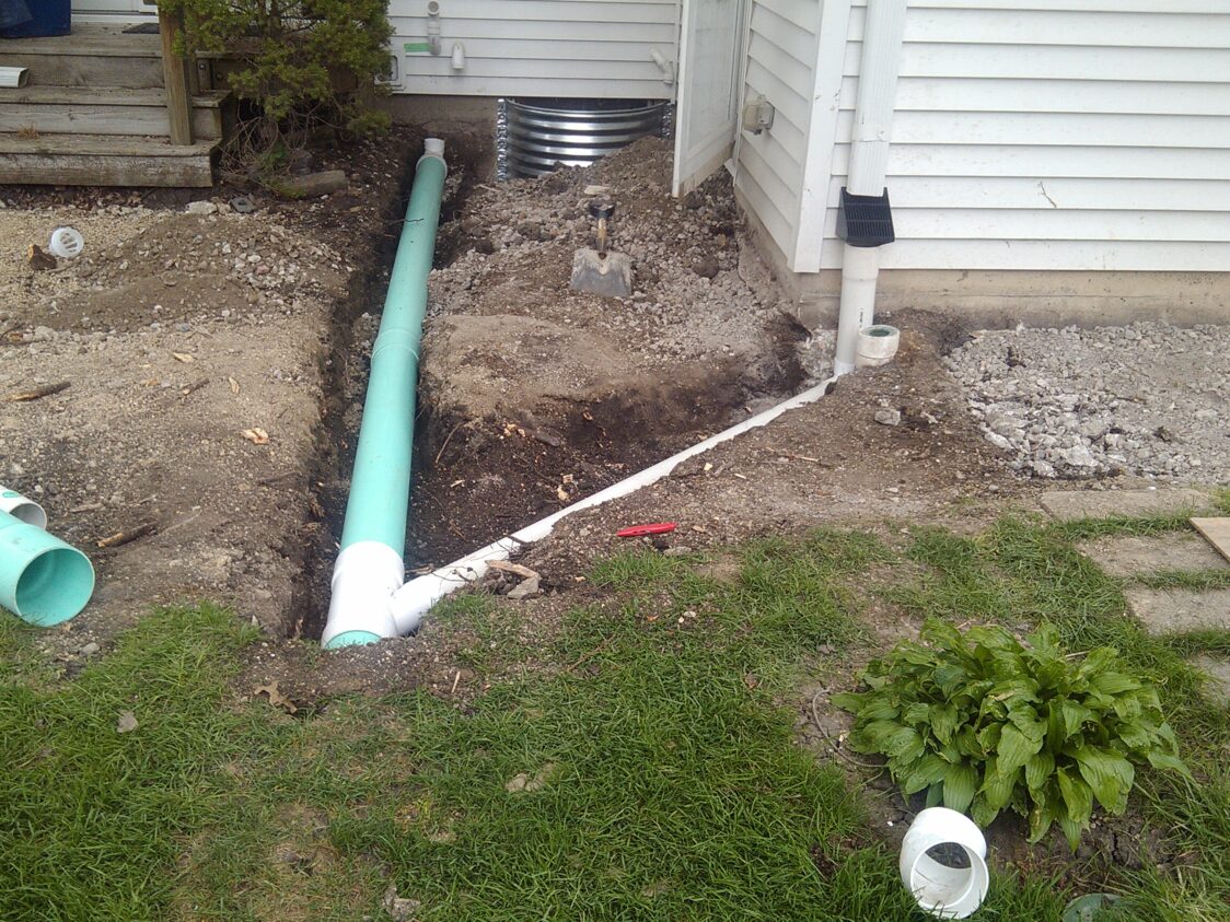 This image shows water drainage solutions being put into place at a home that Jerry's Waterproofing worked on. 
