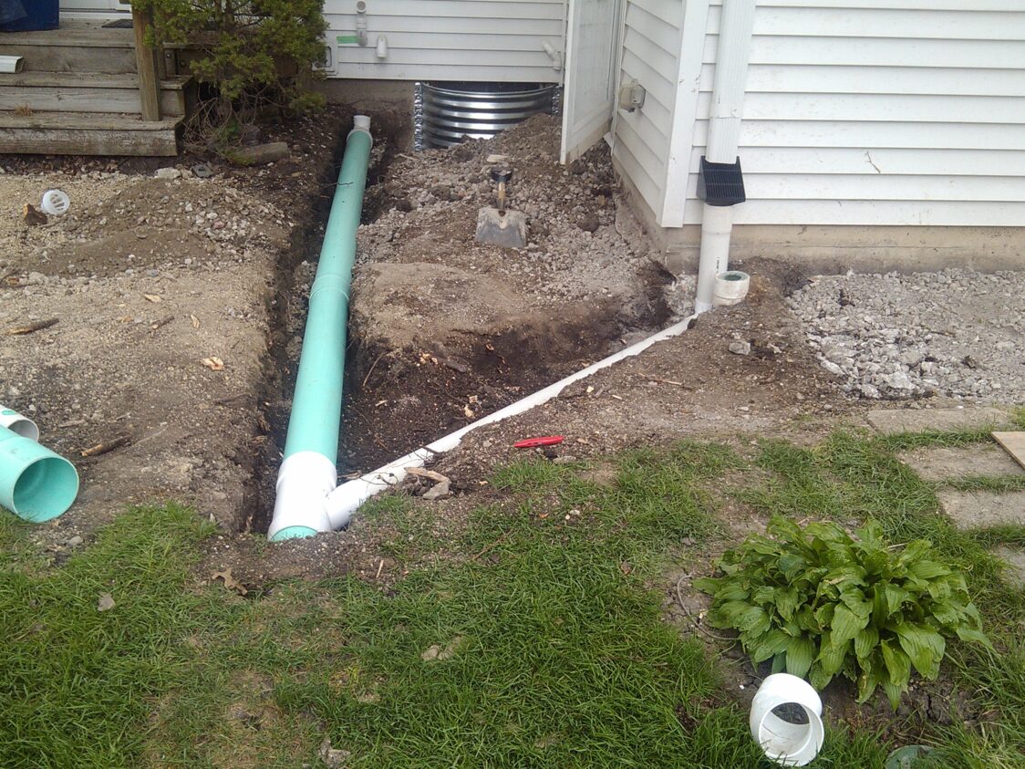 This image shows water drainage solutions being put into place at a home that Jerry's Waterproofing worked on.