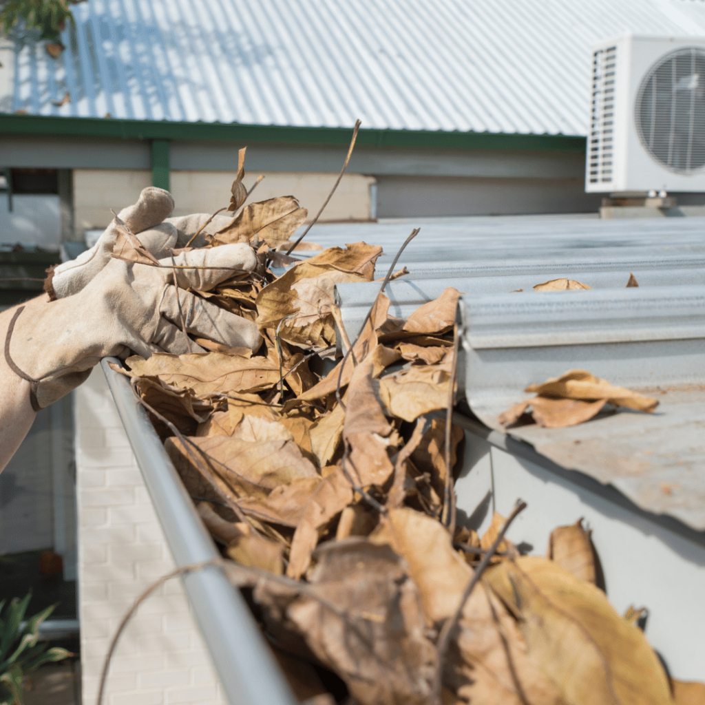 Cleaning out the gutters for better  basement drainage in Iowa.  Moves water away from your foundation.